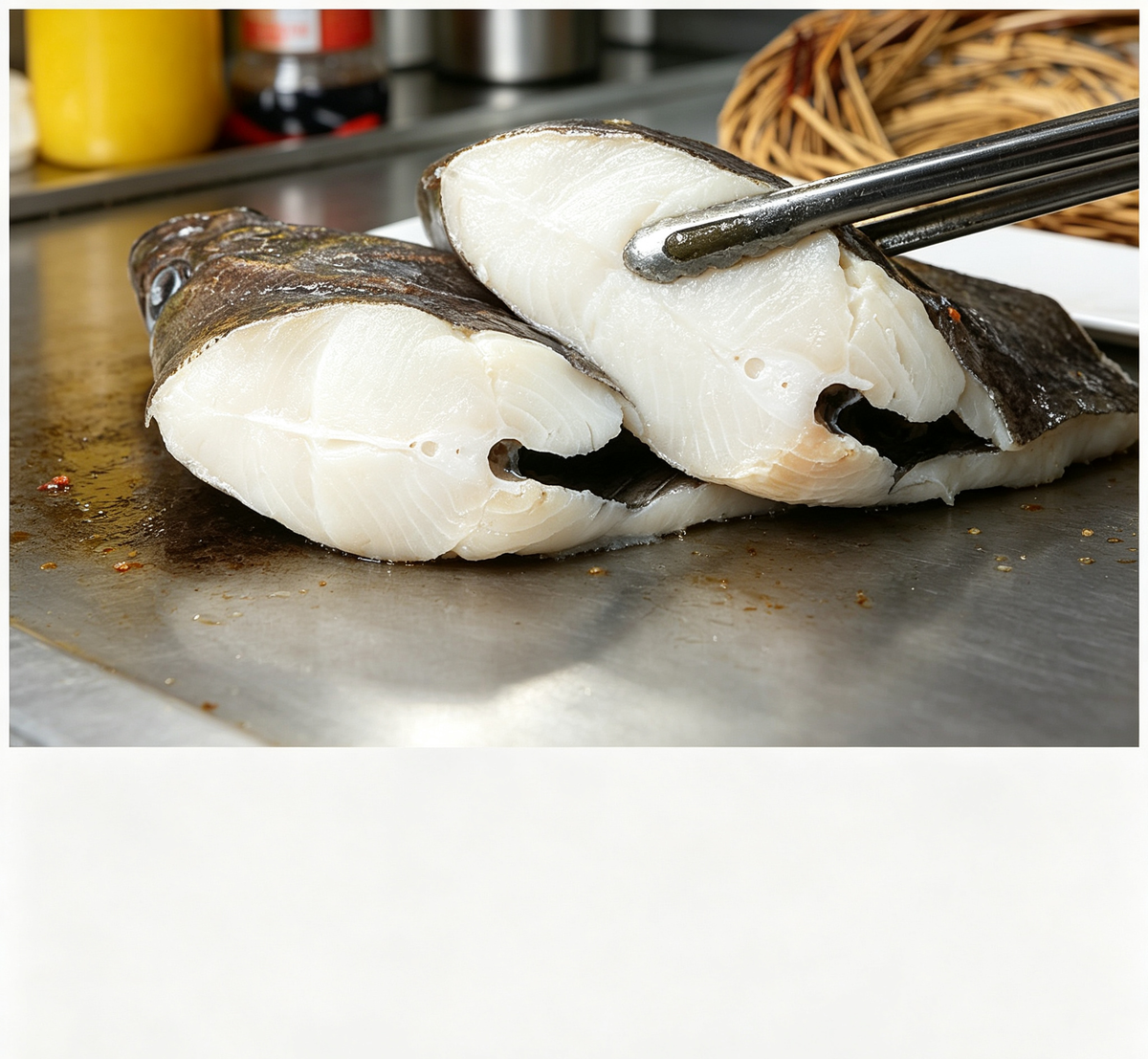 Fresh white fish fillets with dark skin on a white dish (photo 1 of 3)